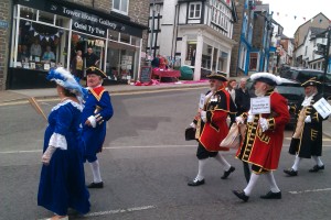 Town criers parade in Knighton with knitters as backdrop