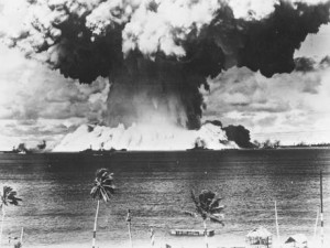 A mushroom cloud rises from the waters of Bikini Lagoon during the United States first series of underwater atomic tests on 7th August 1946 . Ships of a 'Guinea Pig' fleet can be seen against the huge bank of water at the base of the explosion.